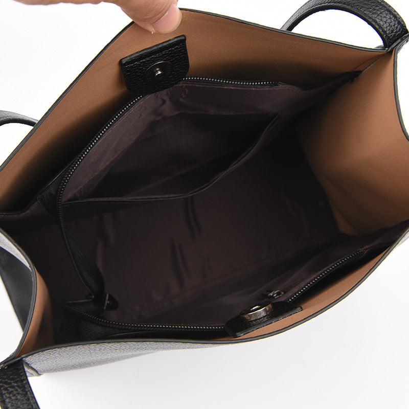 Tan shoulder bag interior with zip opening and fabric lining