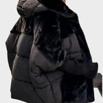Black hooded puffer jacket with plush trim and elastic knit cuffs