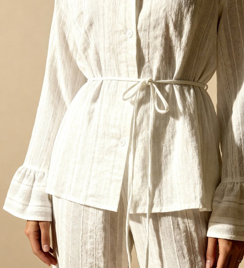 White button-up pajama top with drawstring waist and flared cuffs