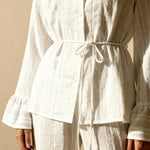 White button-up pajama top with drawstring waist and flared cuffs