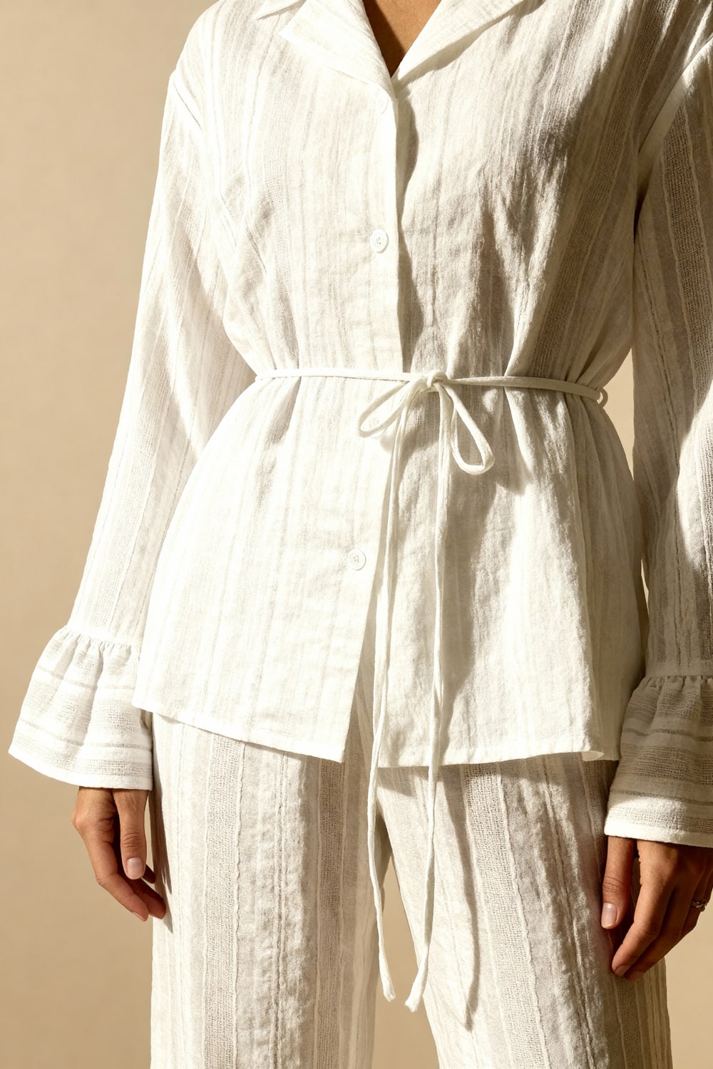 White button-up pajama top with drawstring waist and flared cuffs