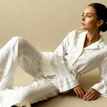 White pajama set with button-up top and wide-leg pants, relaxed fit