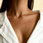 White pajama top with V-neck placket and soft collar detailing