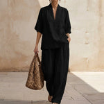 Black women’s two-piece set, V-neck short-sleeve top and wide-leg trousers