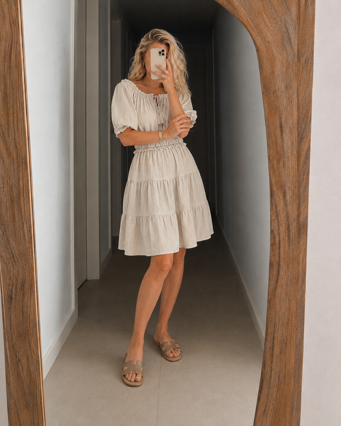 Cream off-shoulder tiered dress with puff sleeves and gathered smocked waist