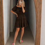 Dark brown off-shoulder tiered dress with short puff sleeves and smocked waist