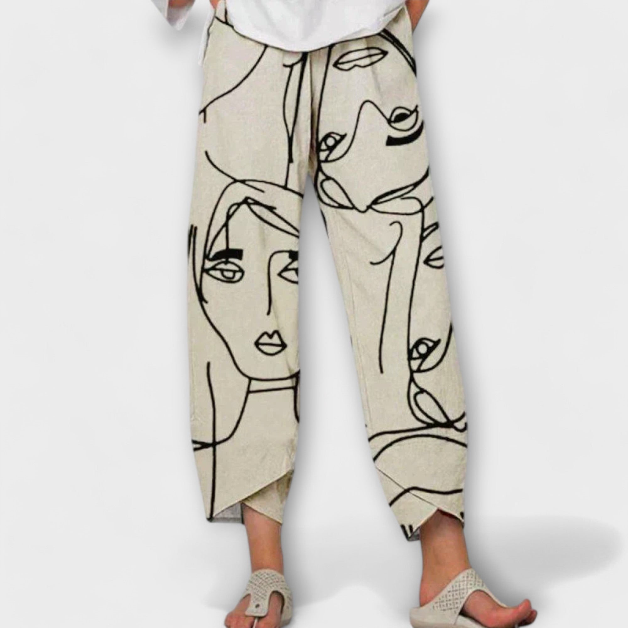 Nahia linen pants with black face line print, drawstring waist and cropped wide legs