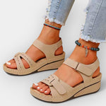 Beige open-toe platform sandals with adjustable strap and stitched cutouts