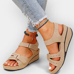 Beige open-toe platform sandals with two hook straps and side cutout