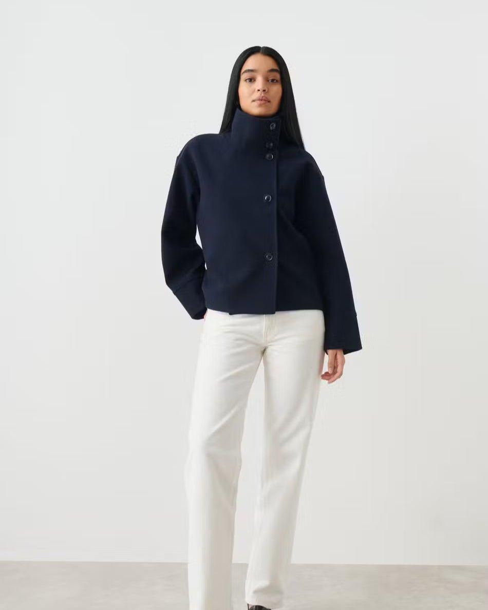 Cropped dark navy jacket with stand collar and button-up front