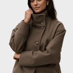 Cropped taupe jacket with high stand collar and three-button front detail