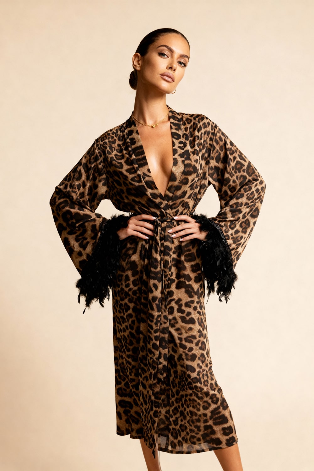 Leopard print kimono robe with deep V-neck and tied waist, faux feather cuffs