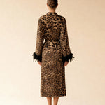 Leopard print long kimono robe with tied waist and faux feather cuffs, back view