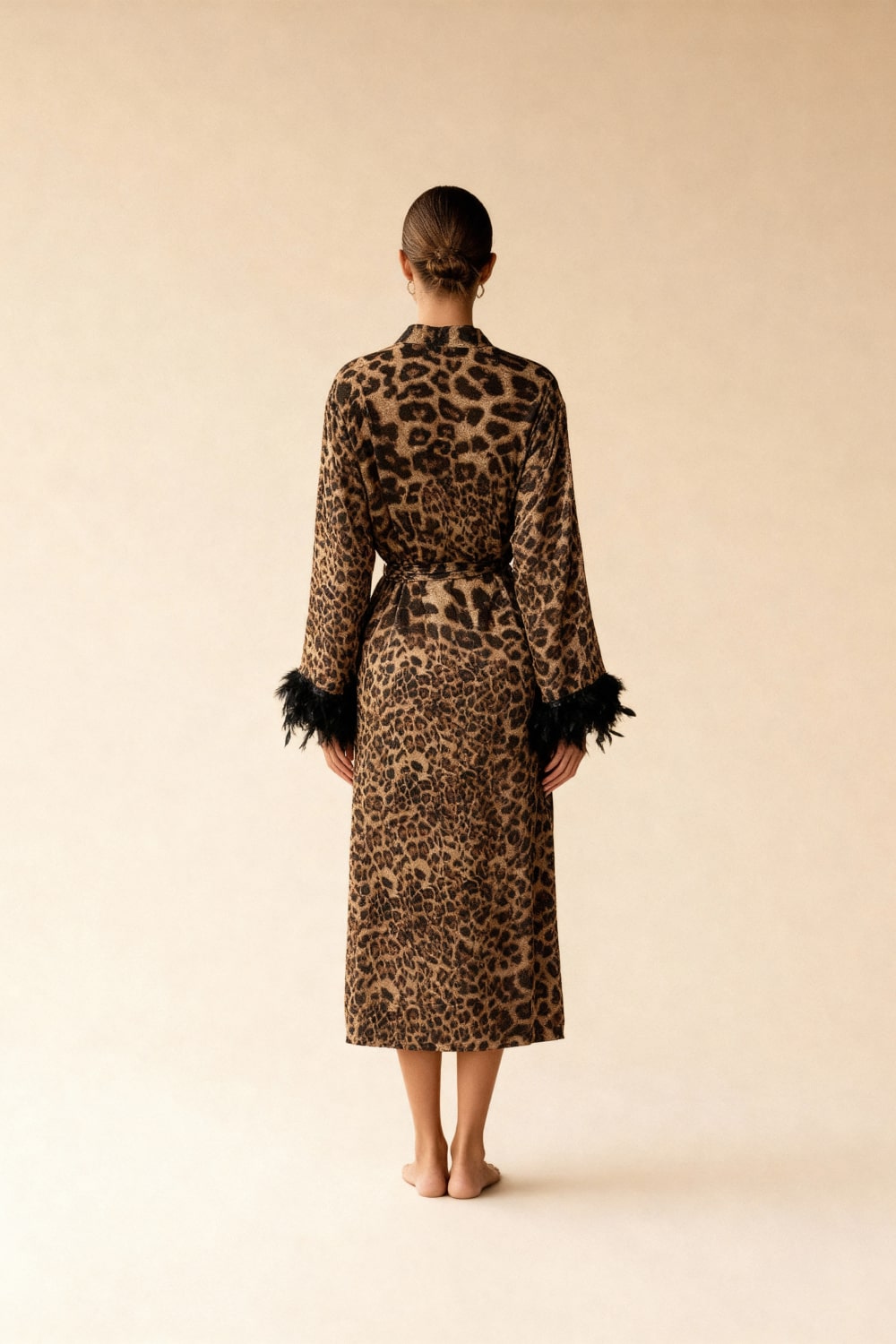 Leopard print long kimono robe with tied waist and faux feather cuffs, back view