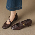 Dark brown round-toe Mary Jane pumps with buckled strap and low block heel