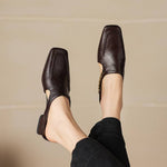 Pair of dark brown leather mule loafers with low block heels