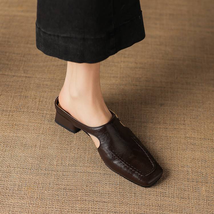 Dark brown leather mule loafers with open side cutout and low block heel