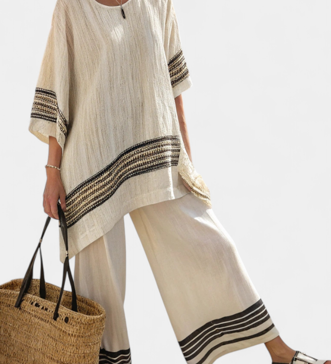 Women’s beige tunic top with black striped trim and wide-leg pants set