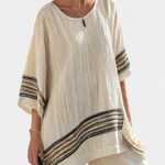 Beige tunic top with black striped hem band and wide-leg pants