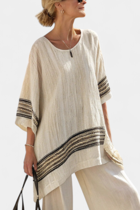 Beige tunic top with black striped hem band and wide-leg pants