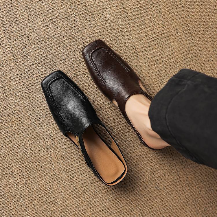 Black and dark brown leather mule loafers with peep cutout and block heels