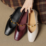 Leather ballet flats in black, burgundy, and beige with gold buckles