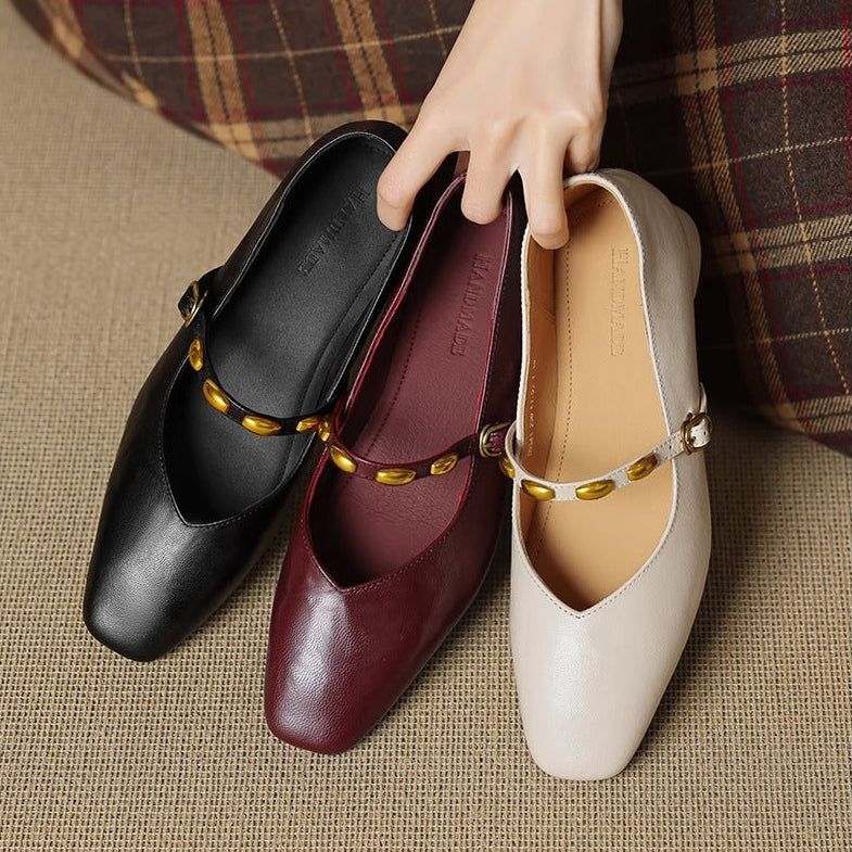 Leather ballet flats in black, burgundy, and beige with gold buckles
