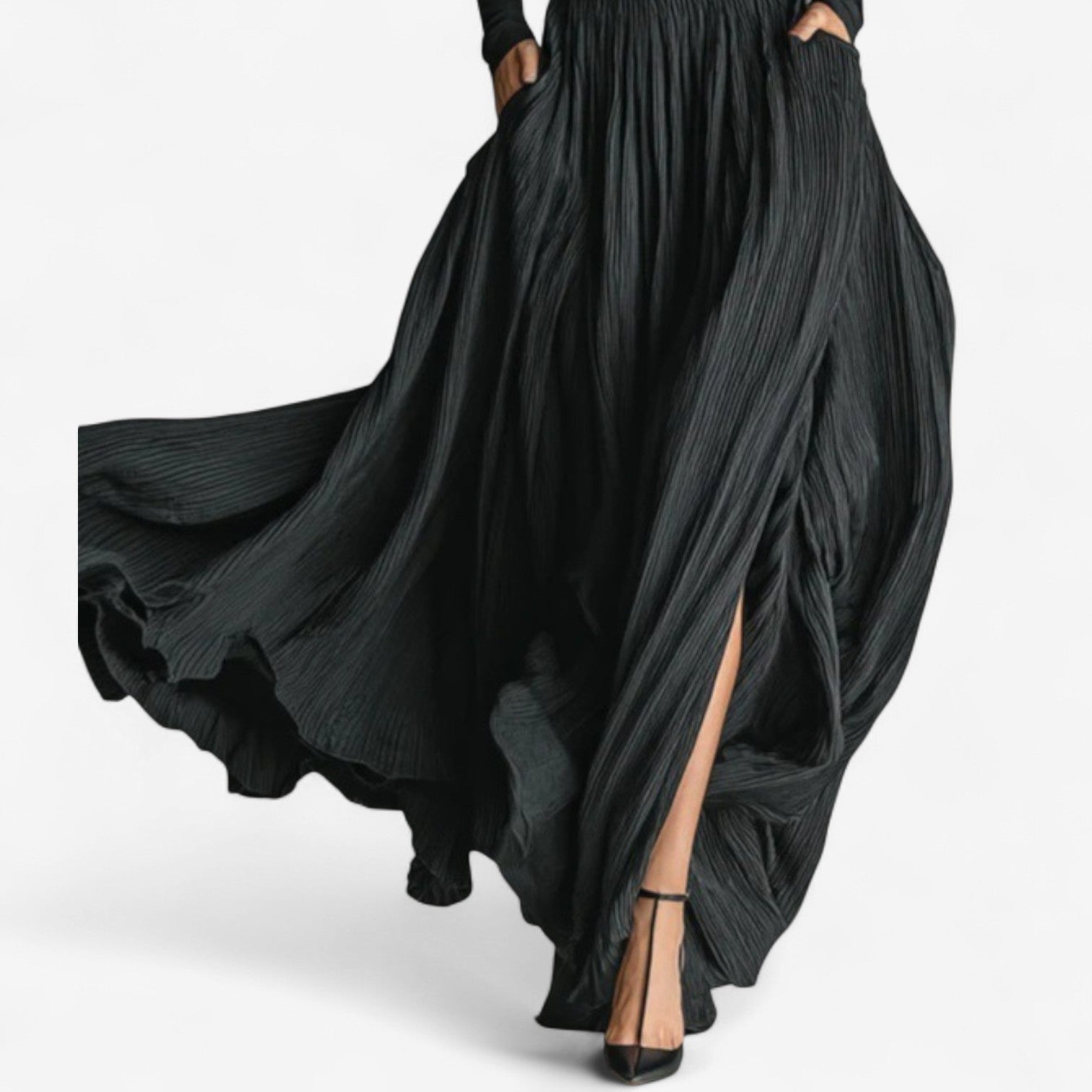 Black high-waist maxi dress with long sleeves, voluminous pleated skirt, and side slit