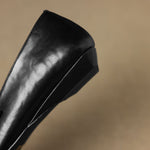 Ceyla black leather Mary Jane heel profile with wedge-style sole
