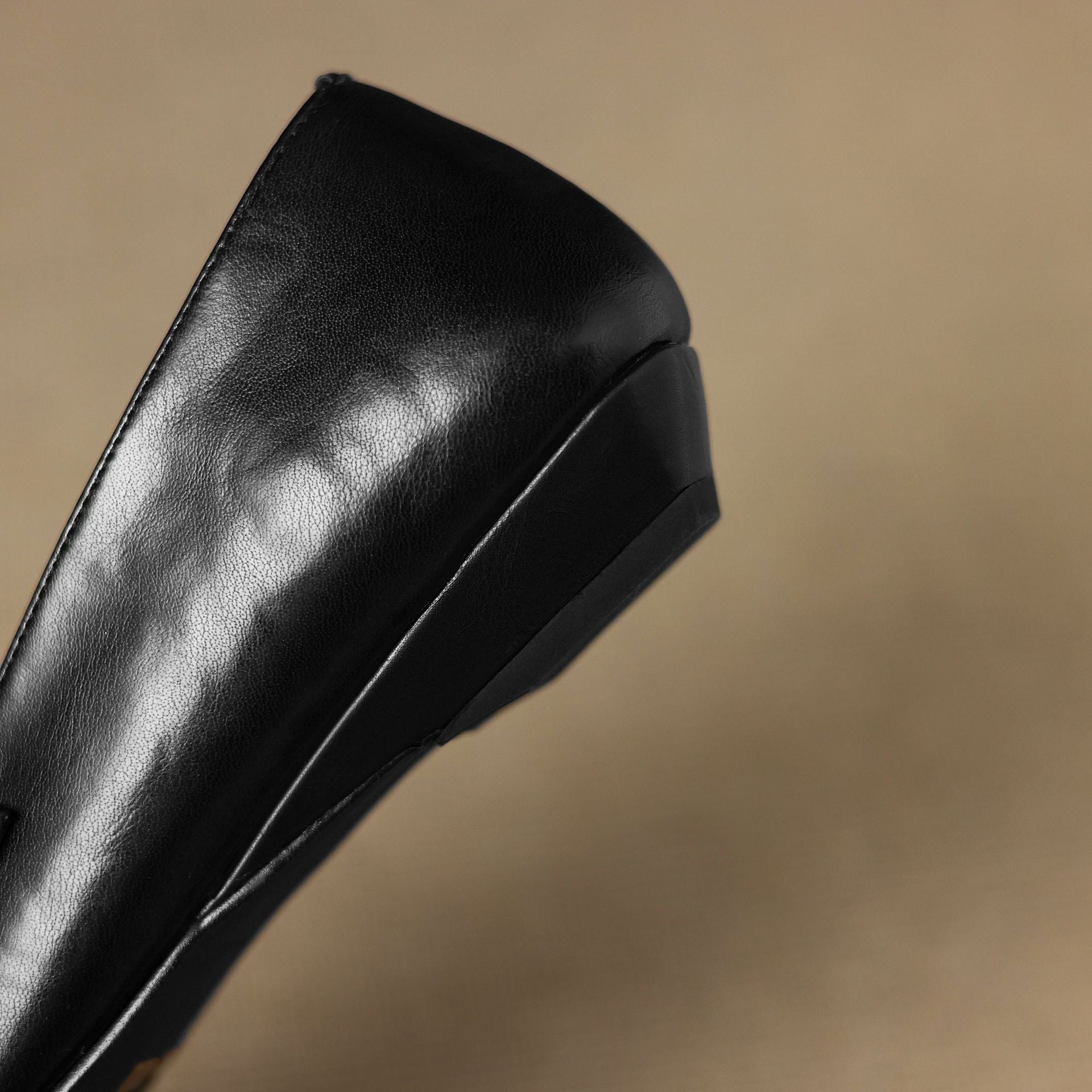 Ceyla black leather Mary Jane heel profile with wedge-style sole