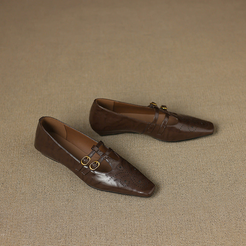 Brown perforated Mary Jane flats with two buckle straps, closed toe design