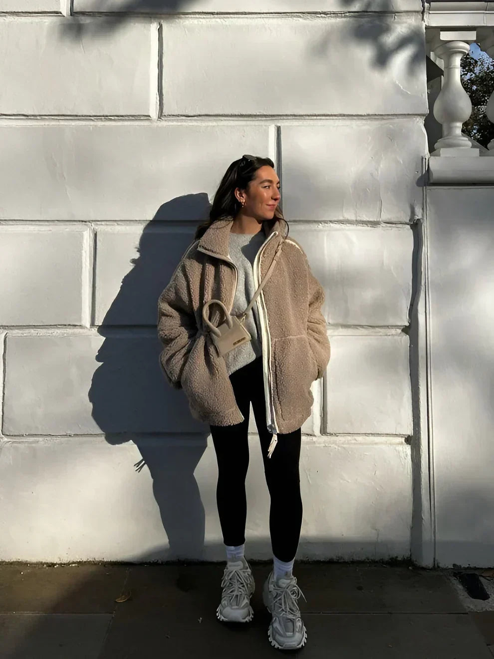 Tan sherpa zip-up winter jacket with stand collar and two front flap pockets