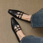 Ceyla black Mary Jane flats with perforated toe and two adjustable strap buckles