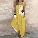 Loose printed overalls, sleeveless yellow with large white daisy floral front, wide legs
