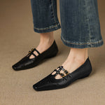 Ceyla black Mary Jane flats with two straps, gold-tone buckles, and perforated toe