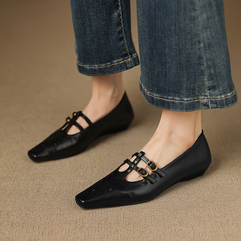 Ceyla black Mary Jane flats with two straps, gold-tone buckles, and perforated toe