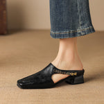 Black leather mule loafers with peep cutout and block heel