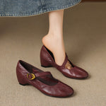 Burgundy round-toe Mary Jane pumps with buckled strap and low block heel