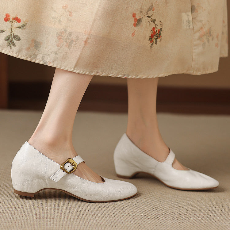 Cream Mary Jane shoes with round toe and gold buckle strap, low heel