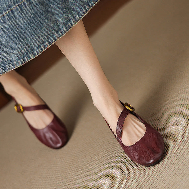 Burgundy Mary Jane pumps with buckled strap and round toe, low block heel