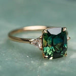 Vintage gold ring with square emerald-cut dark green gemstone and prong setting