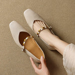 Light beige leather ballet flats with gold buckle strap and tan insole lining