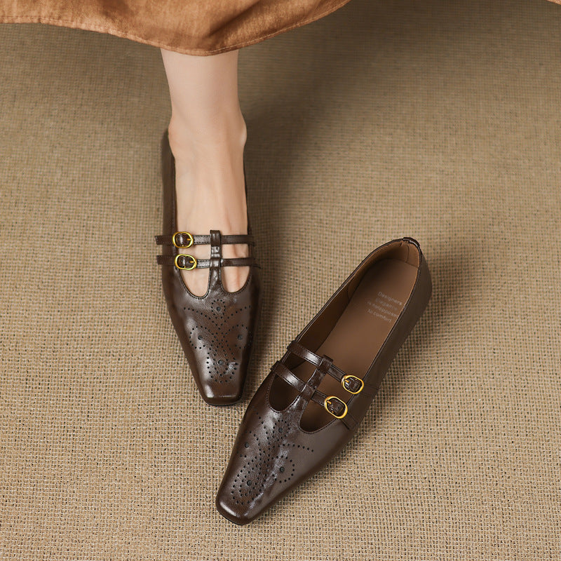 Brown Mary Jane flats with perforated uppers and two buckle straps, side view