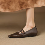 Brown Mary Jane wedge flats with two buckle straps and perforated toe
