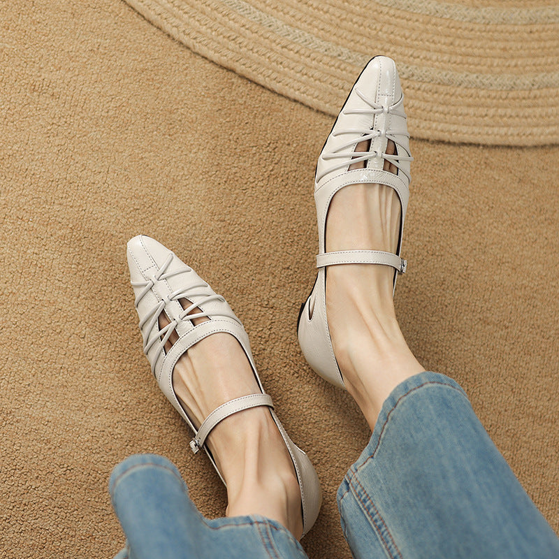Cream Mary Jane flats with ankle strap and lattice-style side panels