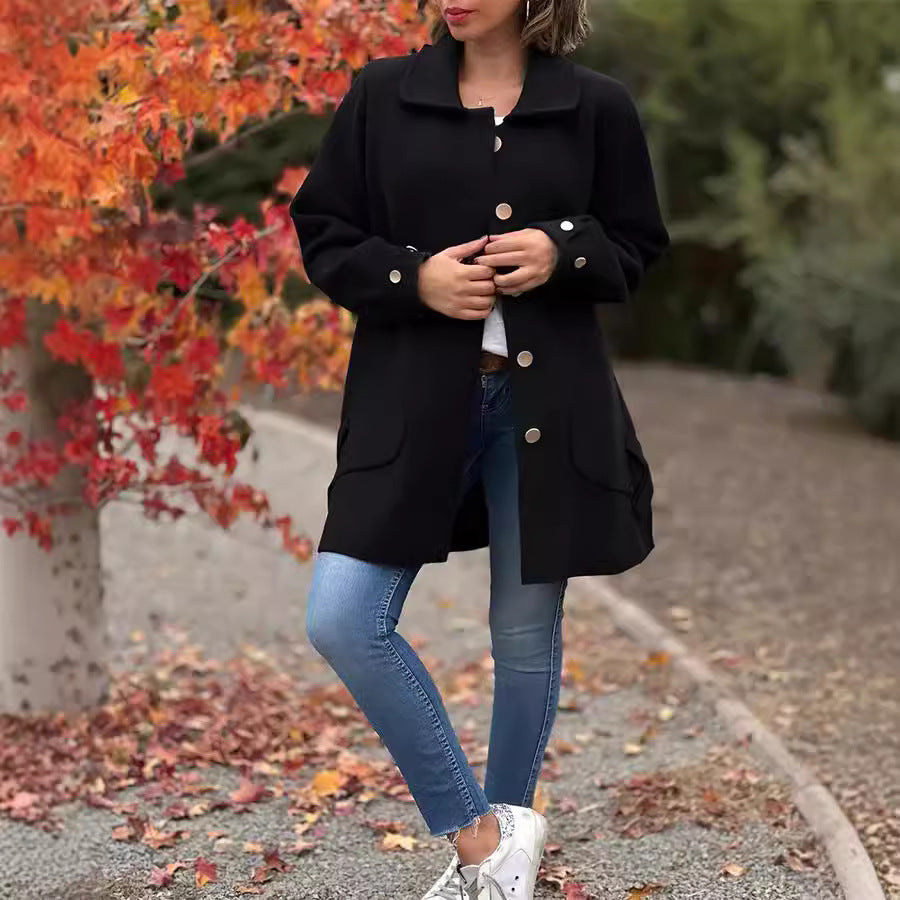 Black button-front coat with notched lapels, long sleeves, and front pockets