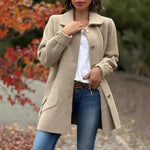 Beige roomy button-front coat with notched lapels, long sleeves, and front pockets