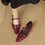 Burgundy Mary Jane flats with ankle strap, buckle, laced design, pointed toe.