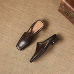 Set of dark brown leather mule loafers with cutout toe and block heels