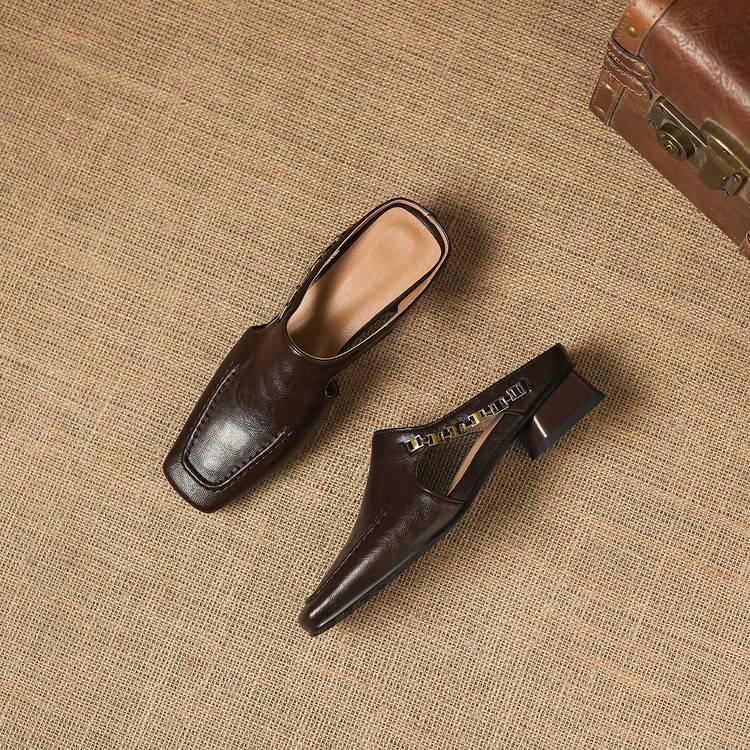 Set of dark brown leather mule loafers with cutout toe and block heels